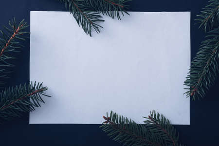 Cute countdown to Christmas with reindeer face formed of snow antlers, cone eyes and a red alarm clock counting down to midnight for a nose over grey with copyspaceの写真素材