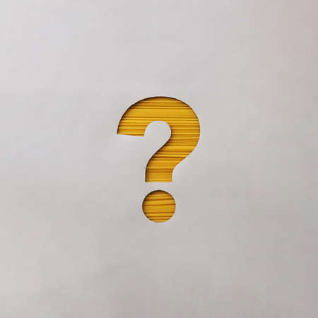 Creative minimal question mark symbol with yellow spaghetti concept of finding an answer and solving a problem and healthy foodの写真素材