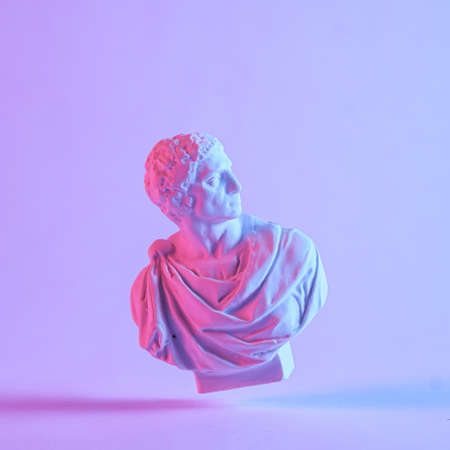 Floating antique style Grecian or Roman bust with drop shadow on a matching purple background