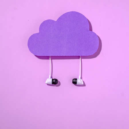 Purple data storage cloud and headphones concept of internet online information and listening to music. Minimal digital technology concept.の写真素材