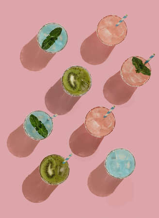 Summer pattern on a bright pink pastel background sunlight fruity orange cocktail plates and tubes. Minimal trend summer concept.の写真素材