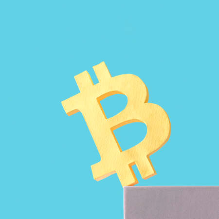 Bitcoin business crypto money and virtual internet currency is teetering on the plane and may fall. Minimal trend creative concept of crisis and success and loss and profit.の写真素材