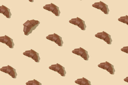 Pattern baking brown croissants for breakfast or dessert. 3d polygon minimal concept pastel.の写真素材