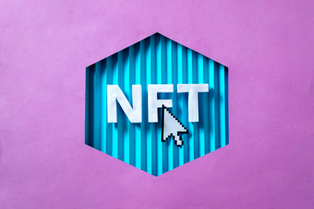 NFT 3D letters and mouse arrow as a concept of blockchain technologies of the future for sale in the virtual marketplace and online business digital art. High quality photoの写真素材