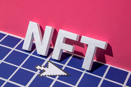 NFT letters and arrow cursor mouse interface. Minimal concept of blockchain based crypto token and innovations of the future for digital art. High quality photoの写真素材