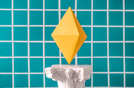 The symbol of the cryptocurrency Ethereum on an antique column in the style of vaporwave. High quality photoの写真素材