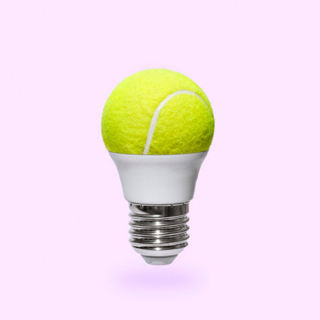 A playful light bulb and a tennis ball. Minimal was the idea of modern tenchnology, sports, recreation and a healthy lifestyle. High quality photoの写真素材