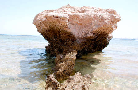 A photo was done at Sharm el Sheikh on 05.04.2009. Warm Red sea on a background of a large reef stone.の写真素材