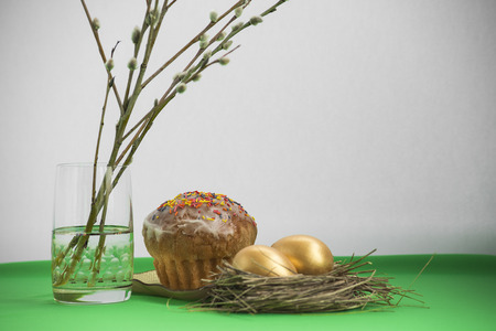 Easter composition with eggs, cake and willow branches.の写真素材