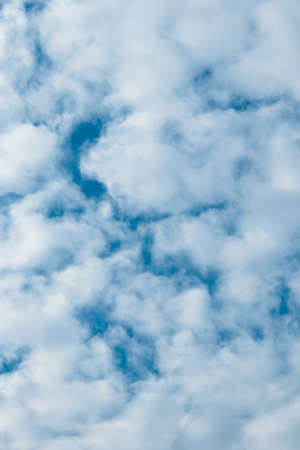 Cloudy sky blue background. Beautiful white fluffy cloud in sunny weather, clear pattern. Outdoors cloudscape environment nature backdrop. God heaven at daylightの写真素材