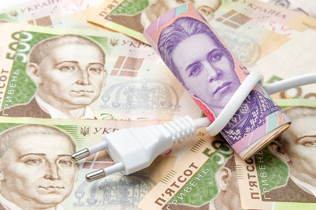 electric network on the background of Ukrainian money hryvnia. The concept and symbol of raising...