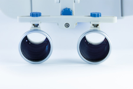 Magnifying binocular glasses close-up. Dental instruments in the clinic. The concept of new...