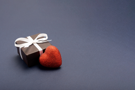 gift wrapped in a red box with a picture of a heart for Valentine's Day. Isolate on white background with shadowの写真素材