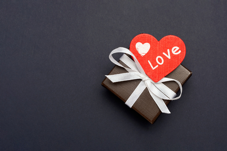 gift wrapped in a red box with a picture of a heart for Valentine's Day. Isolate on white background with shadowの写真素材