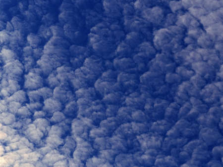 Blue sky with the many  white clouds blurred backgroundの写真素材