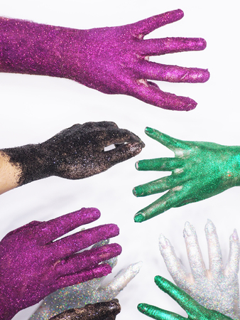 Hand with sequins isolated at whiteの写真素材