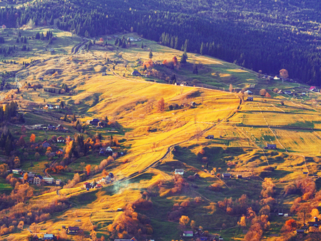 Carpatian village at mountains at the sunny dayの写真素材