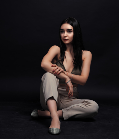 Model brunette posing isolated at blackの写真素材