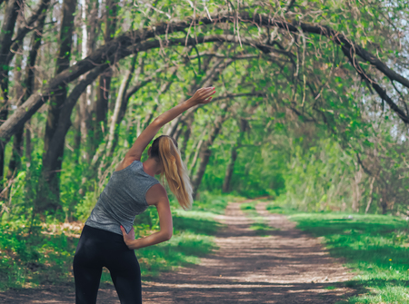 Young girl running at the forest happy