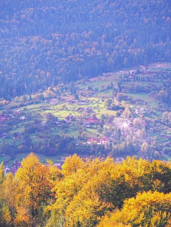 Carpatian village at mountains at the sunny dayの写真素材