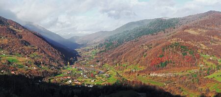 Carpatian village at mountains at the sunny dayの写真素材