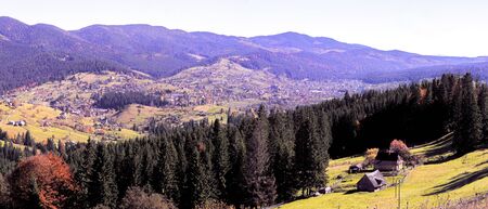 Carpatian village at mountains at the sunny dayの写真素材