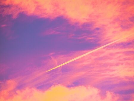 Plane at the colorful skyの写真素材