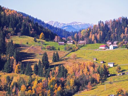 Carpatian village at mountains at the sunny dayの写真素材