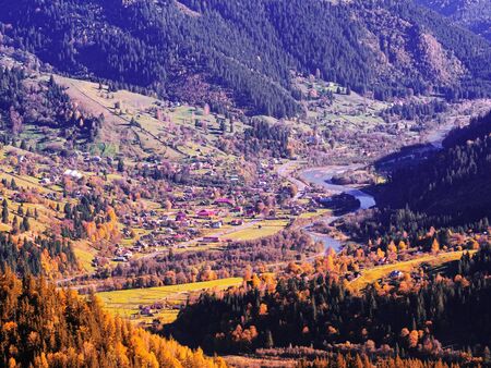 Carpatian village at mountains at the sunny dayの写真素材