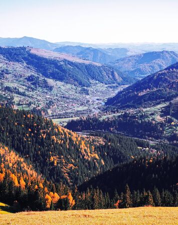 Carpatian village at mountains at the sunny dayの写真素材