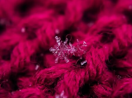 Snowflake beautiful on the red winter backgroundの写真素材