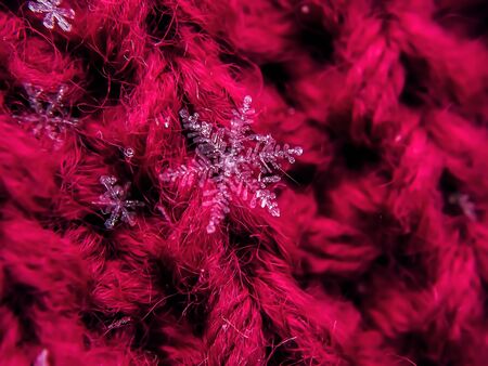 Snowflake beautiful on the red winter backgroundの写真素材