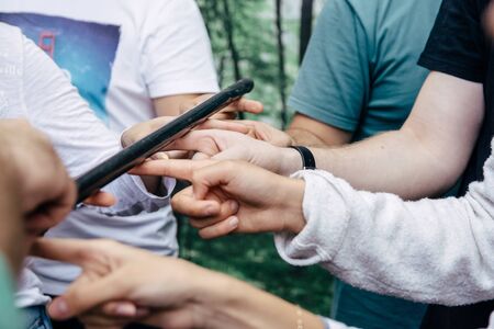 teambuilding activity with stick and hands colleagues