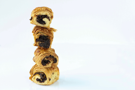 Sweet rolls with poppy stand vertically on each otherの写真素材