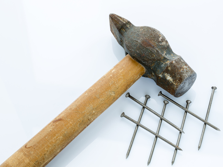 Old hammer and nails. Objects on a light backgroundの写真素材