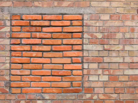 The old wall of the building with a walled red brick window, a frame for designの写真素材