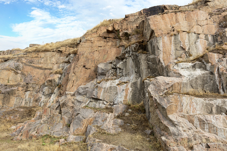 Granite and basalt rock formations against the background of a deep blue skyの写真素材
