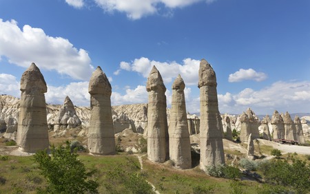 Rural landscape in the Valley of Love, Cappadocia. Large phallic rock formations against the blue summer sky.の写真素材