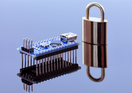 The lock near the computer chip is data encryption, the concept of coding technology of operational information and the protection of personal data.の写真素材