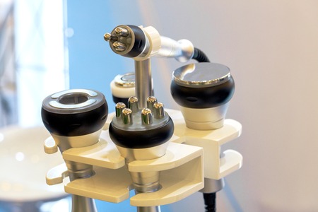 Close-up of various tools of medical cosmetology apparatus for liposuction and massage, used for the...