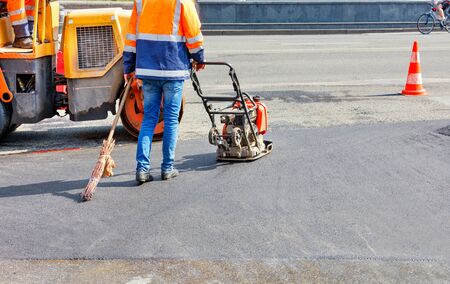 The old gasoline vibratory compactor and vibratory roller, as well as the old broom, are actively...