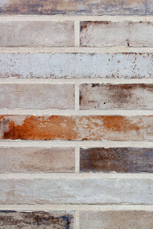 Texture and background of a wall made of old long bricks in the form of brickwork with even...