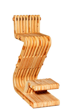 Beautiful elegant comfortable wood bar stool with gentle curves and footrest, cut from thick solid plywood and finished with oil and varnish. Isolated on white background.の写真素材