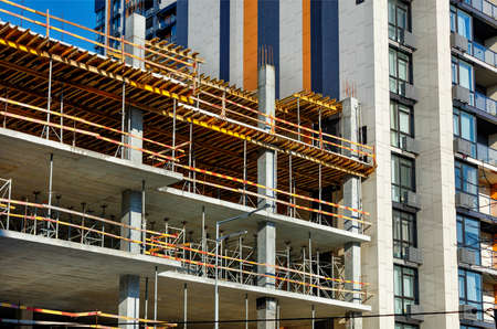 A fragment of the construction of a residential building with the help of concrete pouring of...