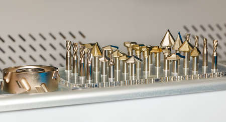 Carbide cutters in a set for use in woodworking machines. closeup. copyspace.