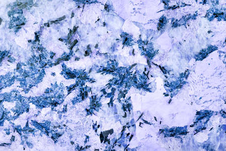 Marble texture of crystals of blue, purple marble with black inclusions, with various inclusions and veins.の写真素材