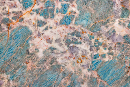 Turquoise marble with beige flecks and rusty veins, polished mineral cut.の写真素材