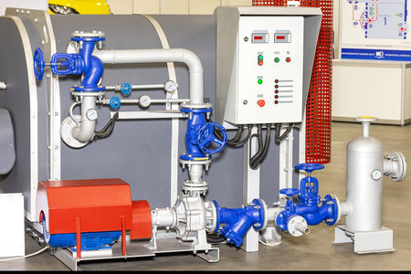 Displays of cutting-edge plumbing technology capture attention at a bustling exhibition. Bright blue pipes and machinery stand out, illustrating the complexity and innovation in modern plumbing.の写真素材