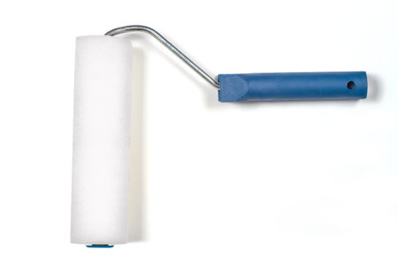 Foam roller for painting walls on a white background.White roller with blue plastic handle.