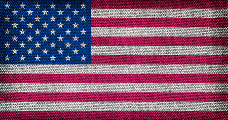 Flag of the United States of America with the texture of rough fabric. A stylized image of the American flag.の写真素材